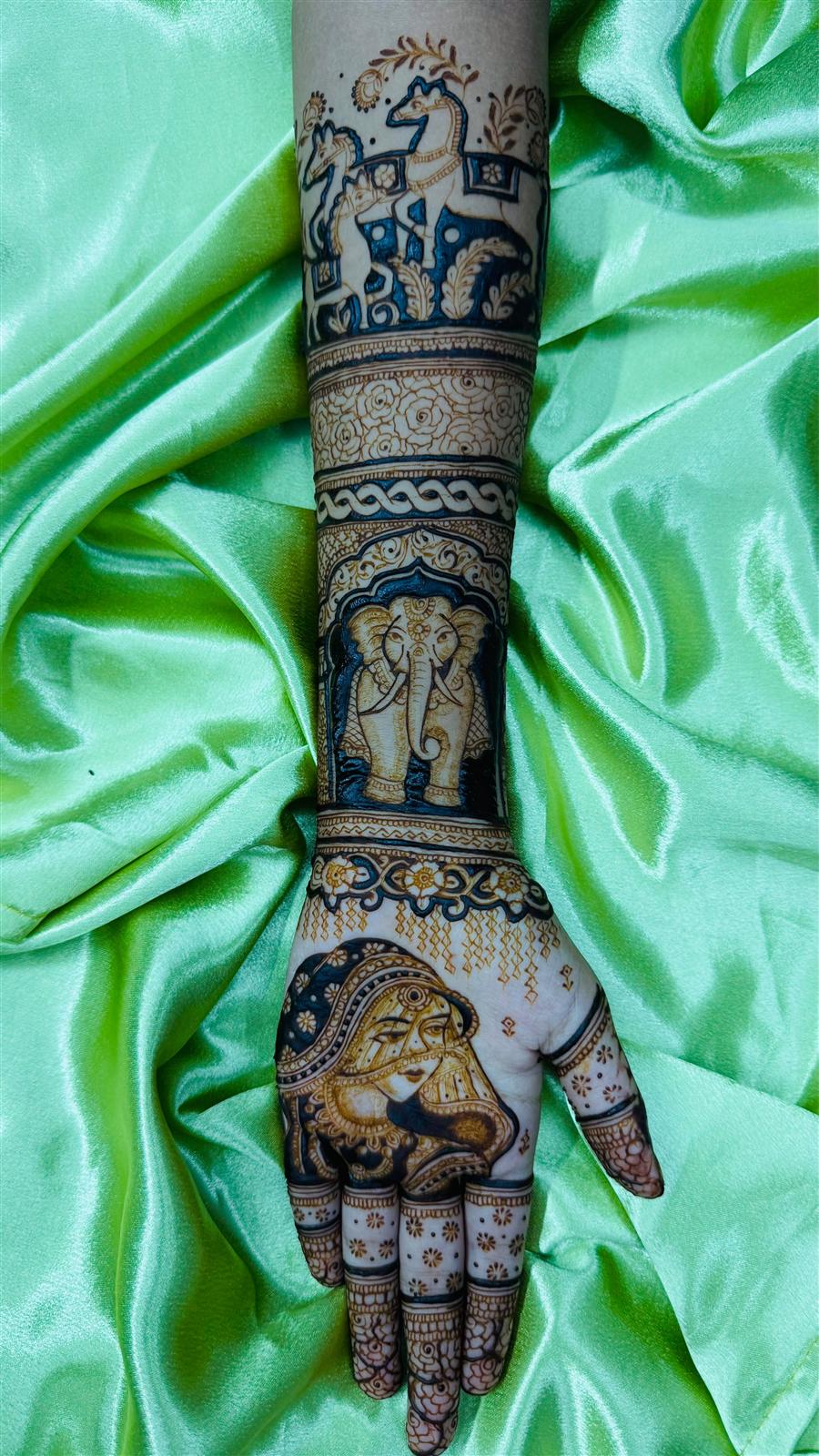 Bridal arm with bride face, elephant and horse