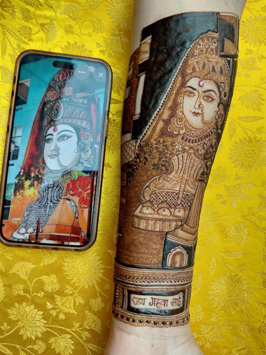 Goddess mural recreated in henna from a photo